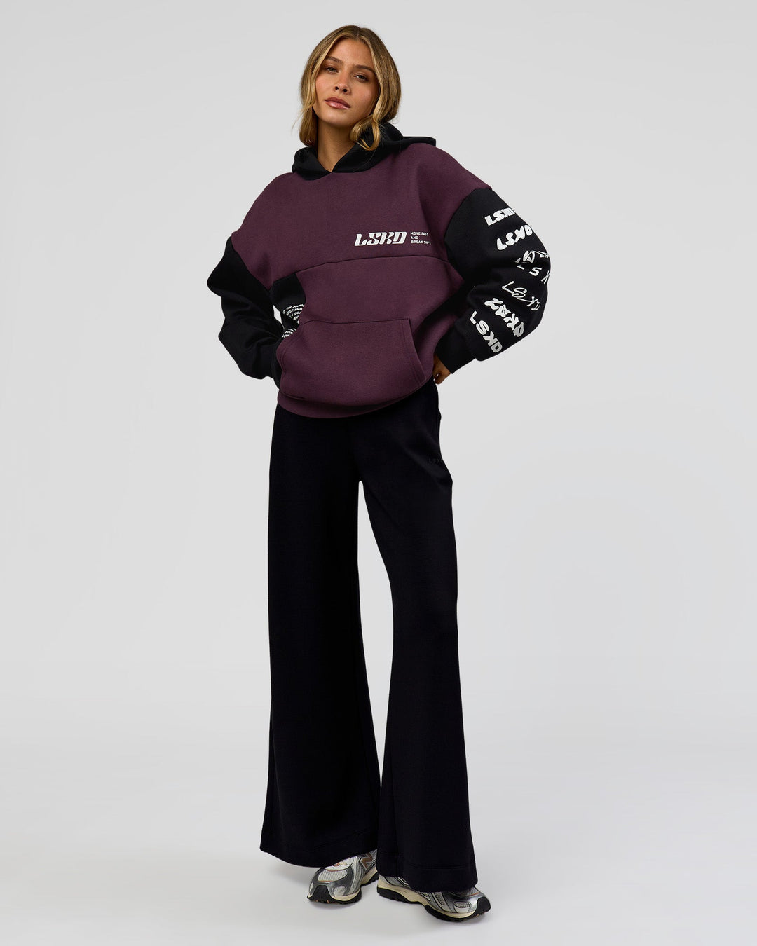 Woman wearing Deconstructed Fleece Hoodie - Caviar-Midnight Plum | Model:Leilani | Size:XS