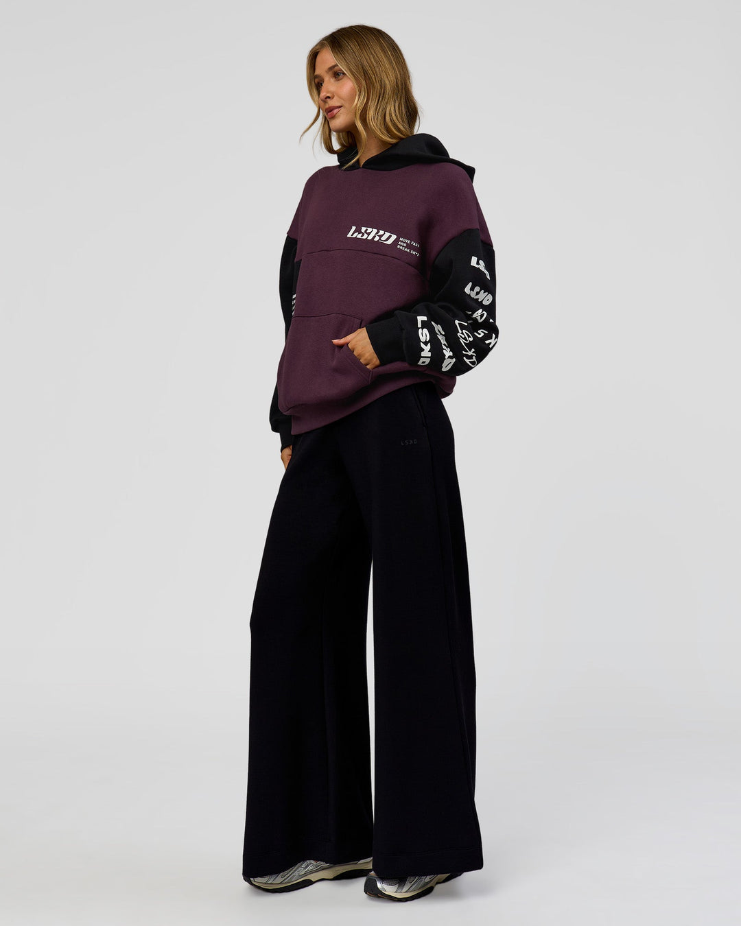 Woman wearing Deconstructed Fleece Hoodie - Caviar-Midnight Plum | Model:Leilani | Size:XS