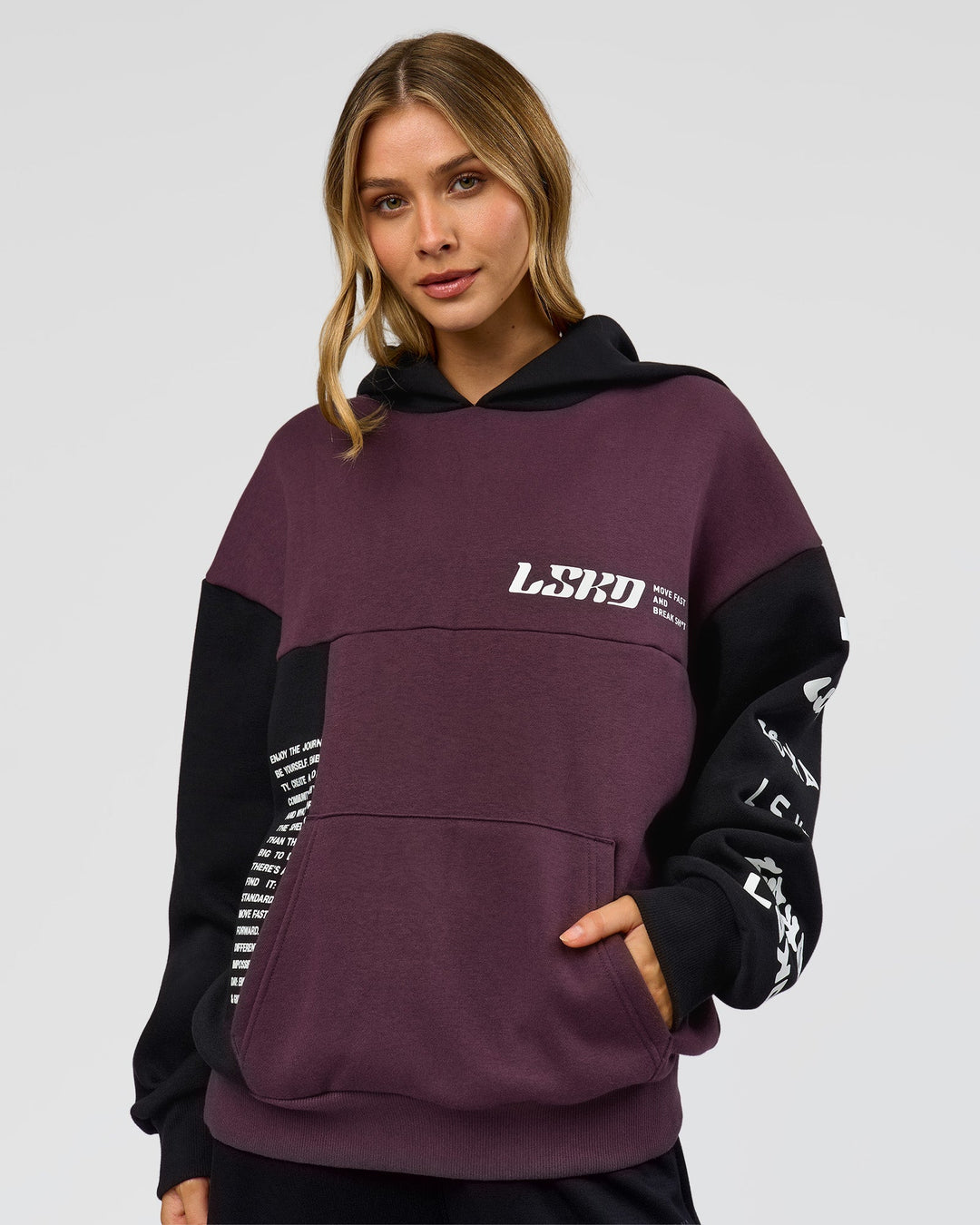 Woman wearing Deconstructed Fleece Hoodie - Caviar-Midnight Plum | Model:Leilani | Size:XS