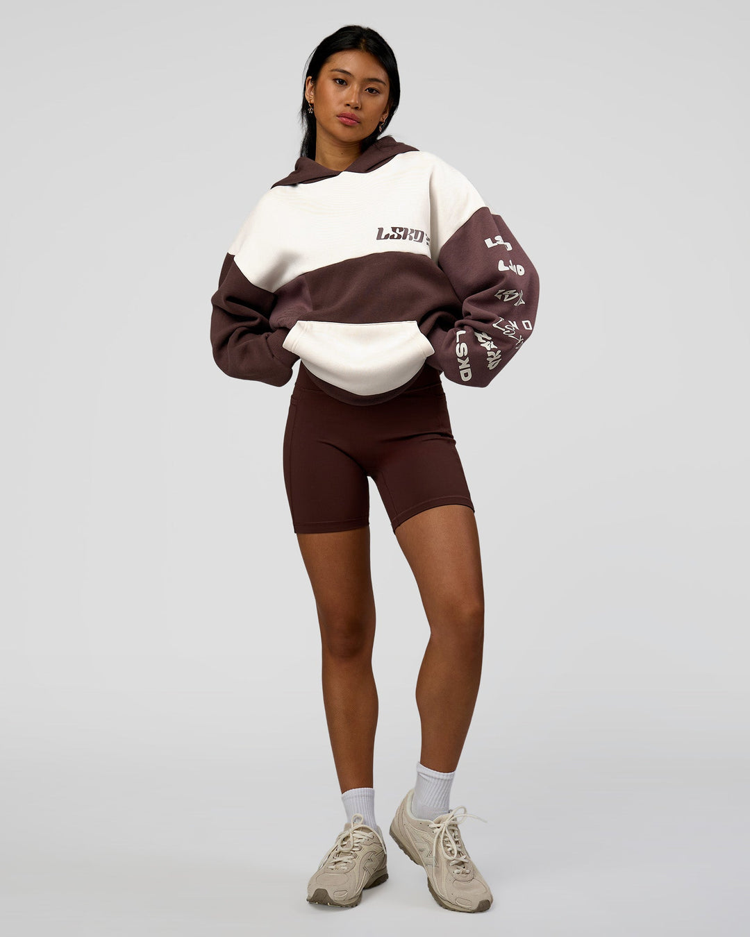 Woman wearing Deconstructed Fleece Hoodie - Off White-Cocoa Powder-Choc | Model:Loren | Size:XS