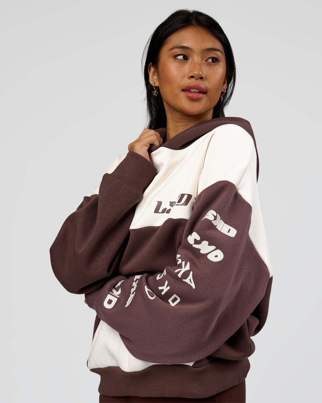 Woman wearing Deconstructed Fleece Hoodie - Off White-Cocoa Powder-Choc | Model:Loren | Size:XS