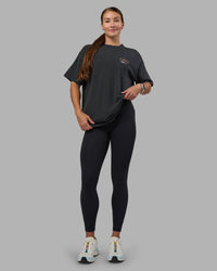 Woman wearing Digital World Heavyweight Oversized Tee - Washed Black | Model:Hannah | Size:XS