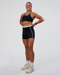 Woman wearing Distinction Sports Bra 2.0 - Black-White | Model:Sav | Size:XS