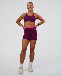 Woman wearing Distinction Sports Bra 2.0 - Plum Caspia-Ultra Pink | Model:Sav | Size:XS