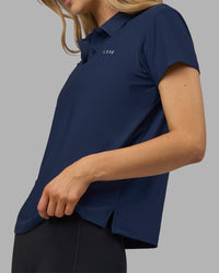 Woman wearing Drive Polo - Future Navy | Model:Leilani | Size:XS | Thumbnail Index: 1