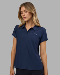 Woman wearing Drive Polo - Future Navy | Model:Leilani | Size:XS | Thumbnail Index: 0