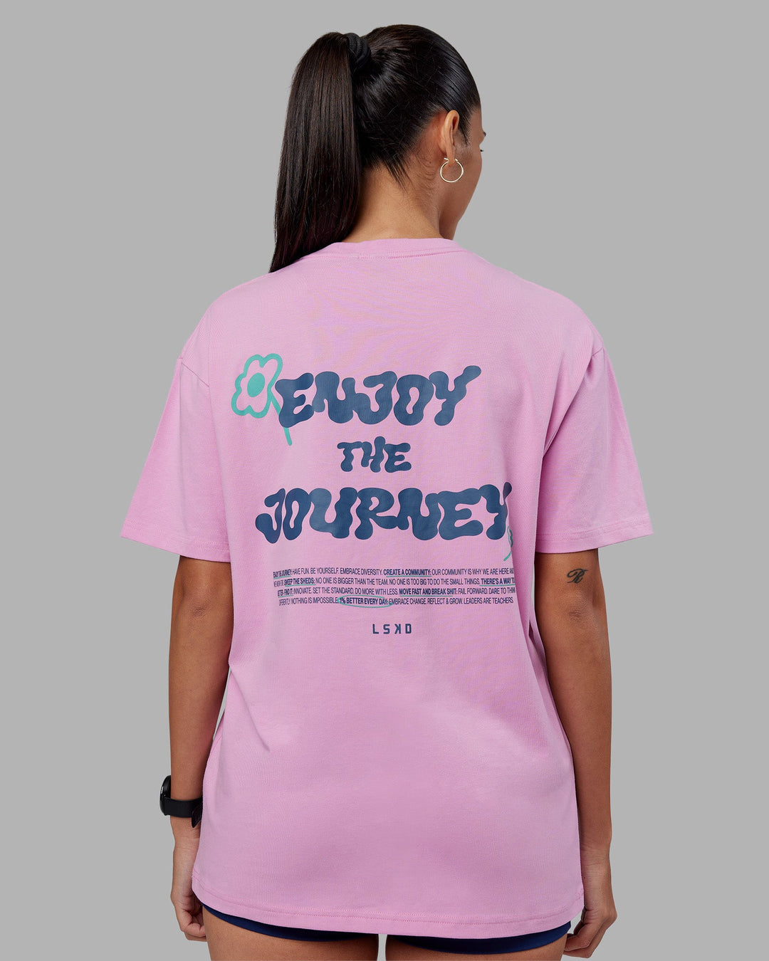 Woman wearing ETJ Values FLXCotton Oversize Tee - Bubblegum-Indigo | Model:Rhiley | Size:XS