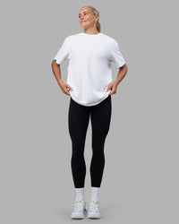 Woman wearing Easy FLXCotton Tee Oversize - White | Model:Katie | Size:XS