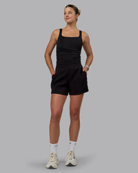 Woman wearing Elevate SoftTouch 4" Shorts - Black-Black