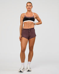 Man wearing Elevate Sports Bra - Black-Multi | Model:Maja | Size:XS
