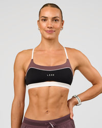Man wearing Elevate Sports Bra - Black-Multi | Model:Maja | Size:XS