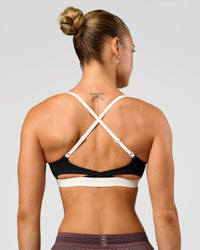 Man wearing Elevate Sports Bra - Black-Multi | Model:Maja | Size:XS