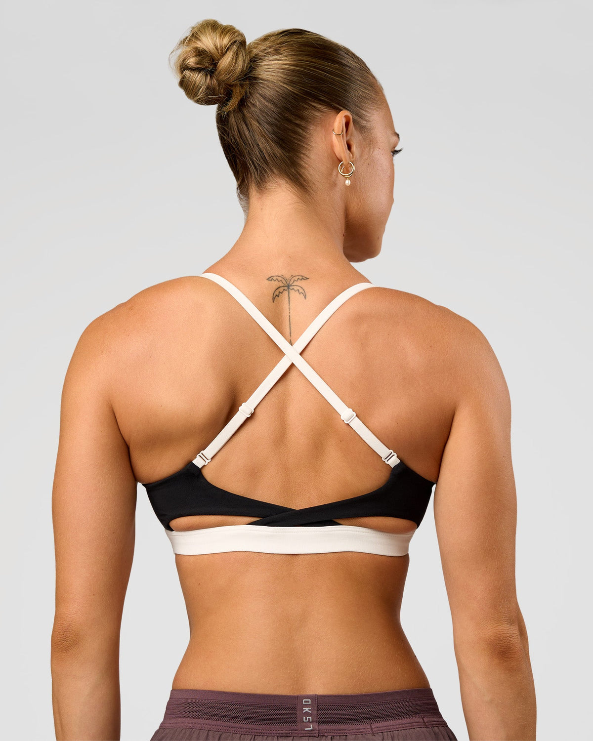 Man wearing Elevate Sports Bra - Black-Multi | Model:Maja | Size:XS - view 2