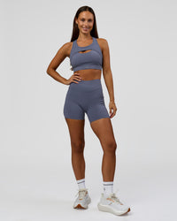 Woman wearing Elite Run High-Rise 5" Short Pockets - Night Shadow | Model:Brylee | Size:XS | Thumbnail Index: 5