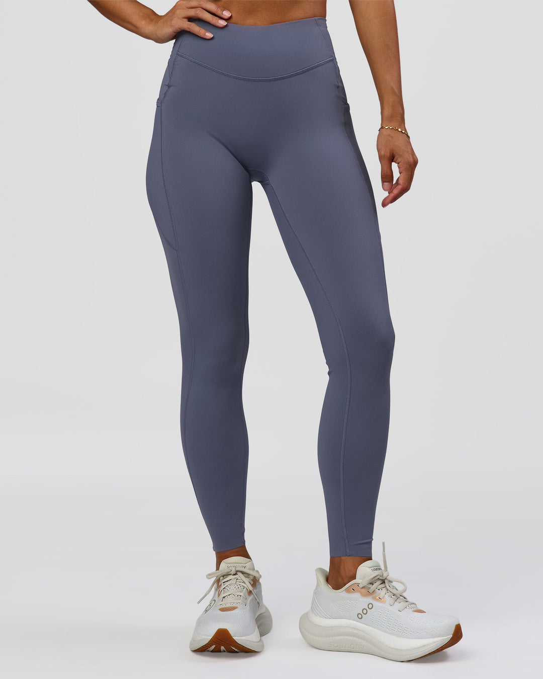 Woman wearing Elite Run High-Rise Full Length Legging Pockets - Night Shadow | Model:Brylee | Size:XS - view 1