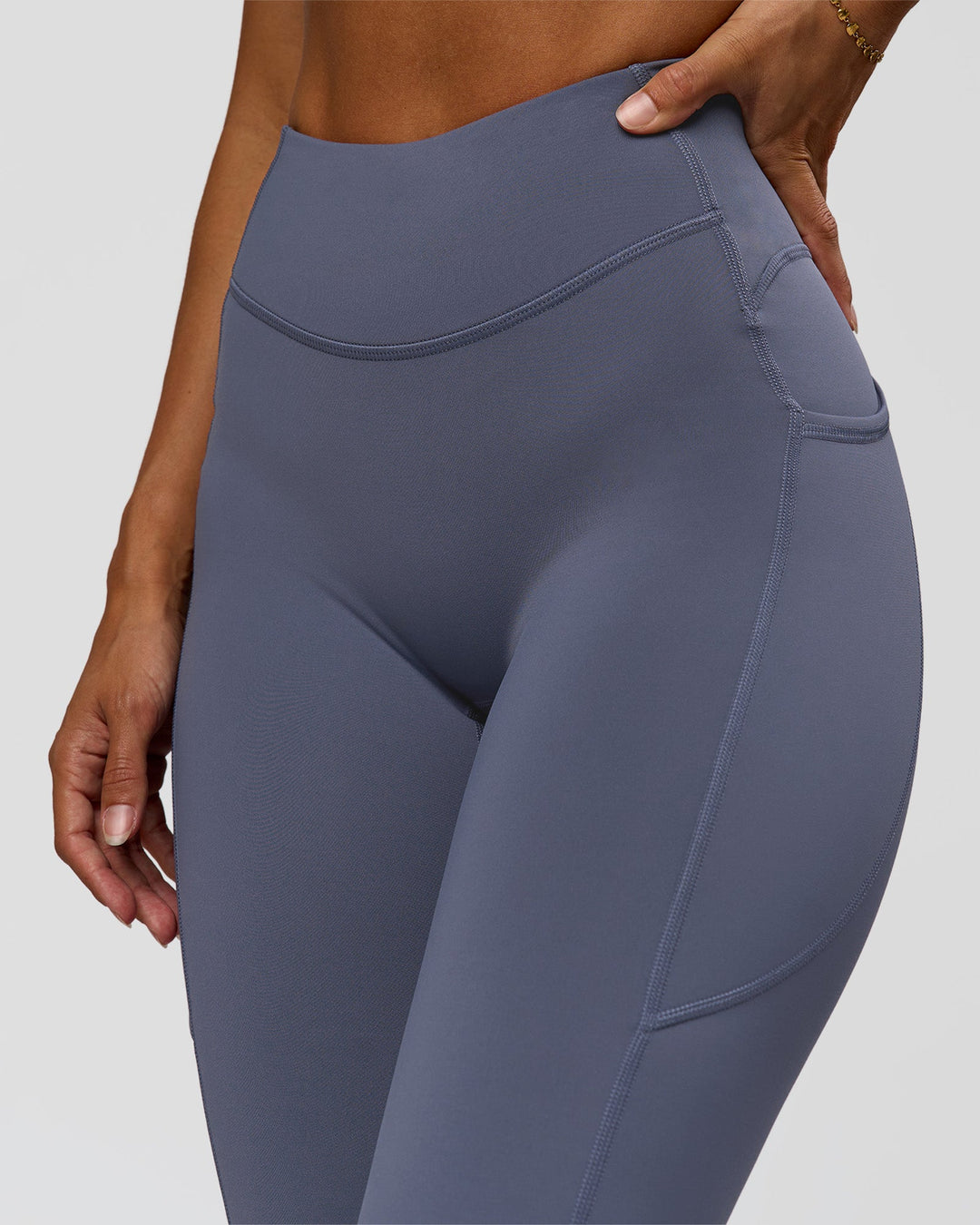 Woman wearing Elite Run High-Rise Full Length Legging Pockets - Night Shadow | Model:Brylee | Size:XS - view 4