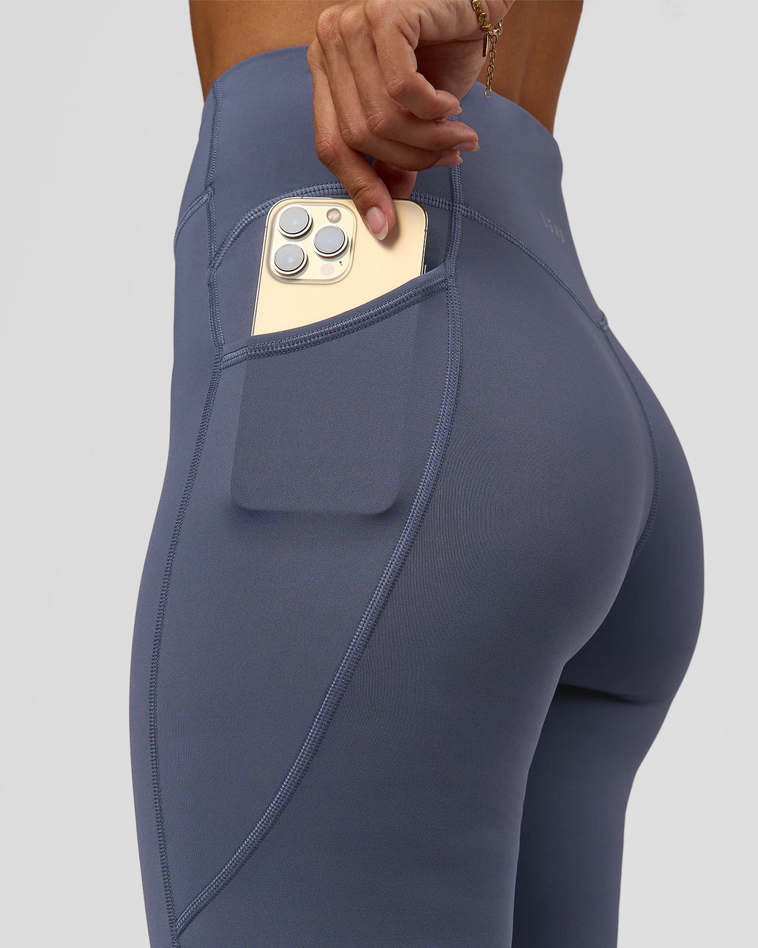 Woman wearing Elite Run High-Rise Full Length Legging Pockets - Night Shadow | Model:Brylee | Size:XS - view 3