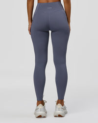Woman wearing Elite Run High-Rise Full Length Legging Pockets - Night Shadow | Model:Brylee | Size:XS | Thumbnail Index: 1