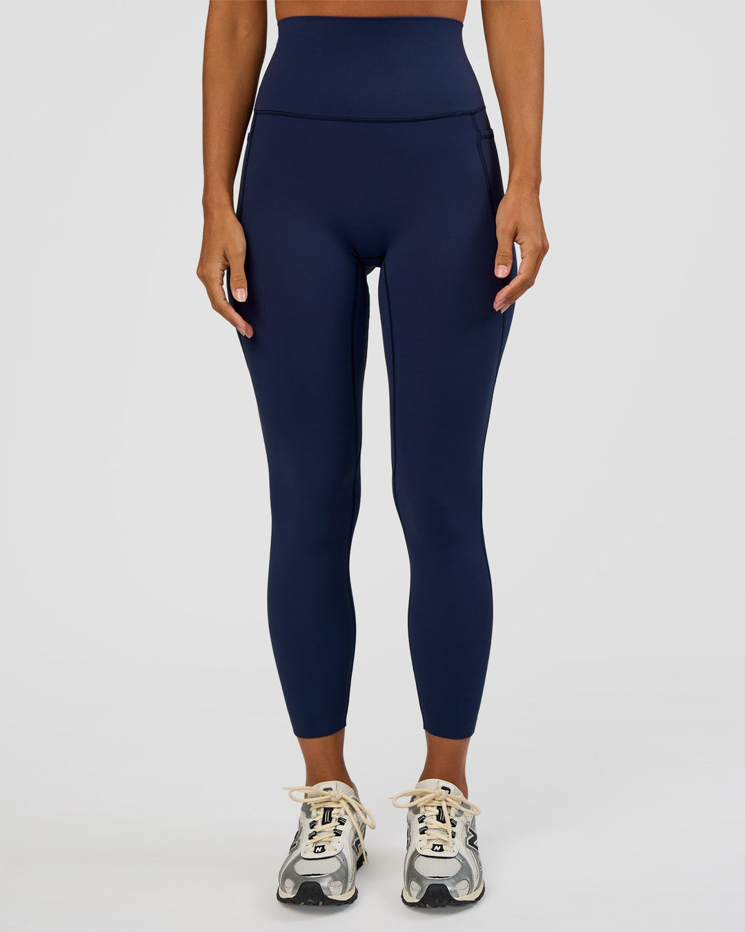 Woman wearing Elixir Ultra High-Rise 7/8 Legging Pockets - Future Navy | Model:Brylee | Size:XS