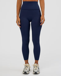 Woman wearing Elixir Ultra High-Rise 7/8 Legging Pockets - Future Navy | Model:Brylee | Size:XS