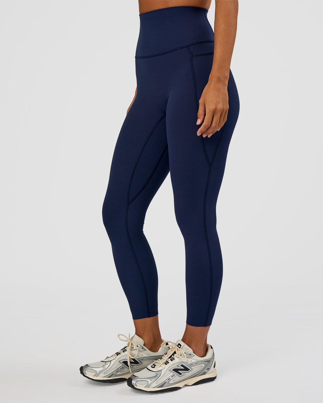 Woman wearing Elixir Ultra High-Rise 7/8 Legging Pockets - Future Navy | Model:Brylee | Size:XS
