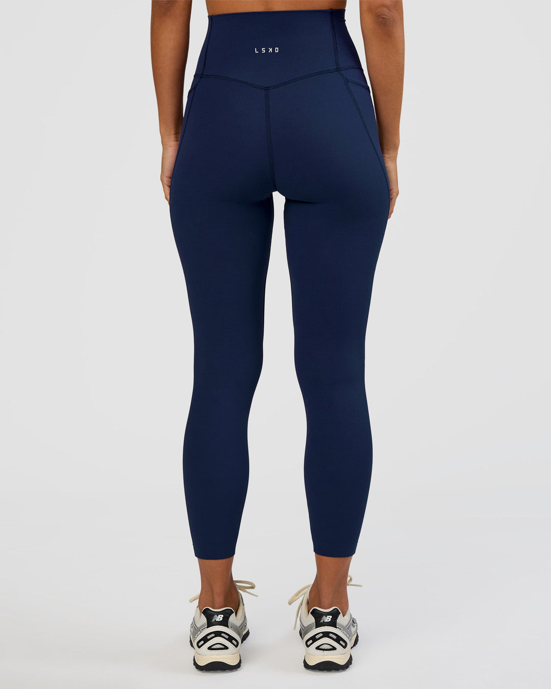 Woman wearing Elixir Ultra High-Rise 7/8 Legging Pockets - Future Navy | Model:Brylee | Size:XS