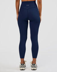 Woman wearing Elixir Ultra High-Rise 7/8 Legging Pockets - Future Navy | Model:Brylee | Size:XS
