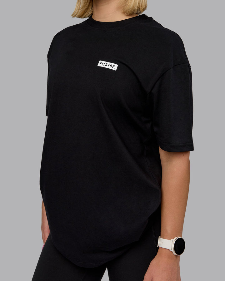 Woman wearing Fitstop Embrace the Sweat FLXCotton Oversized Tee in Black-White | Size:XS
