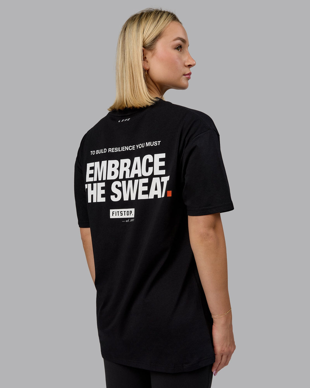 Woman wearing Fitstop Embrace the Sweat FLXCotton Oversized Tee in Black-White | Size:XS