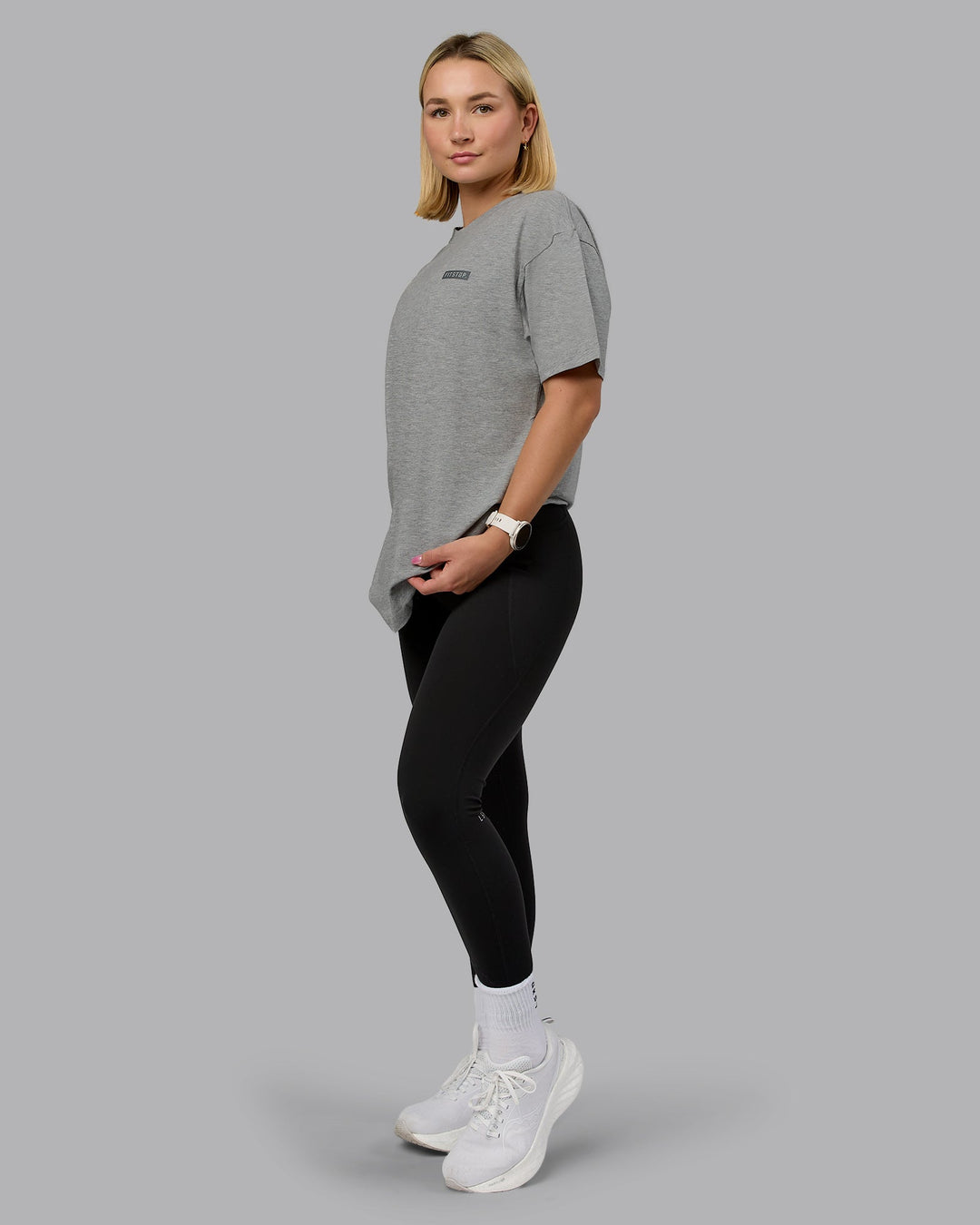 Woman wearing Fitstop Embrace the Sweat FLXCotton Oversized Tee in Light Grey Marl-Cool Grey | Size:Xs