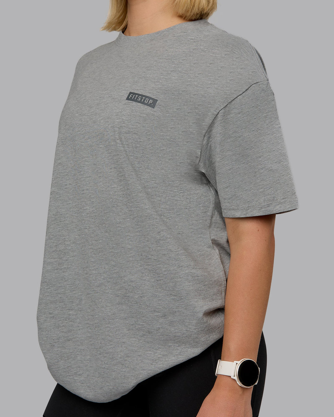 Woman wearing Fitstop Embrace the Sweat FLXCotton Oversized Tee in Light Grey Marl-Cool Grey | Size:XS