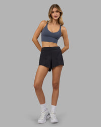 Woman wearing Flash Longline Sports Bra - Night Shadow | Model:Leilani | Size:XS | Thumbnail Index: 4