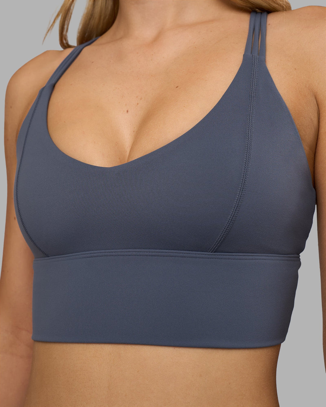 Woman wearing Flash Longline Sports Bra - Night Shadow | Model:Leilani | Size:XS