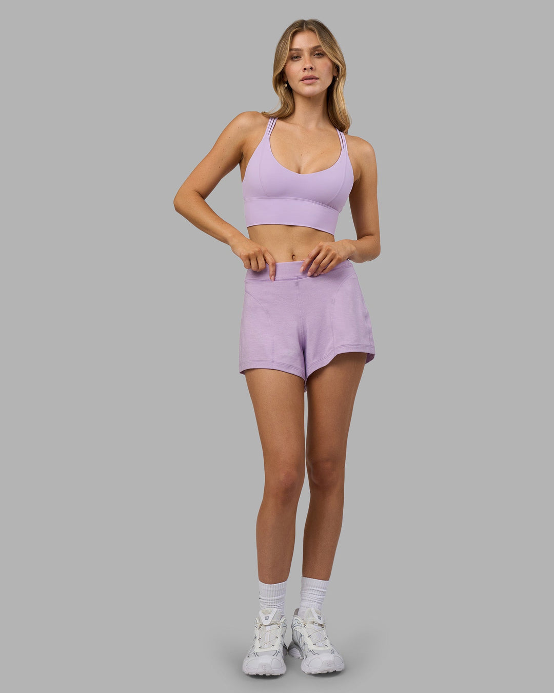 Woman wearing Flash Longline Sports Bra - Pale Lilac | Model:Leilani | Size:XS