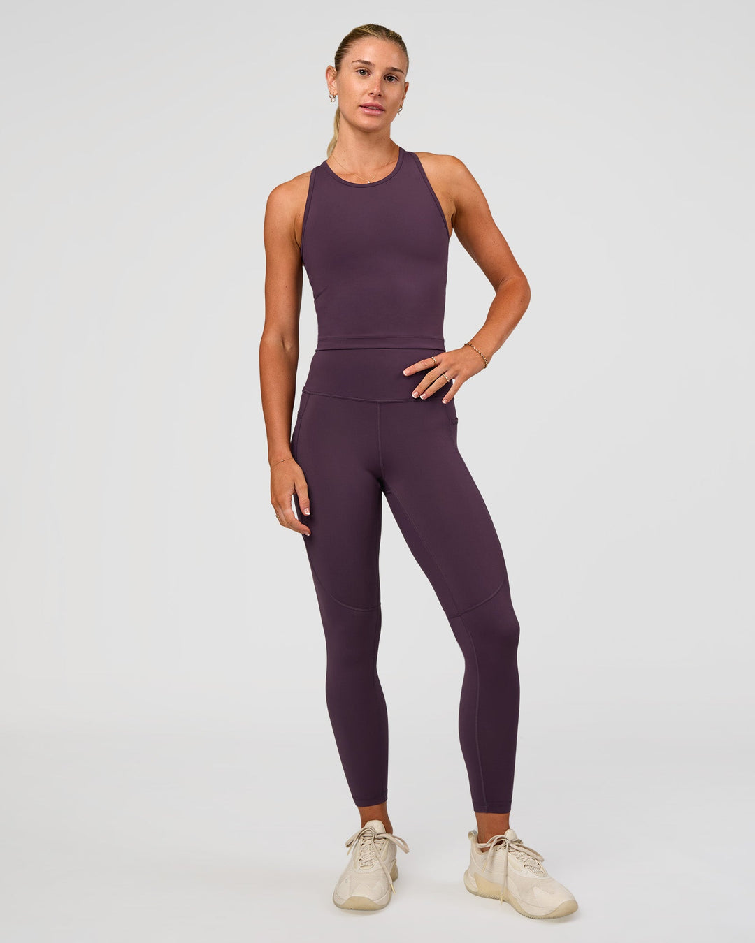 Woman wearing Flow Performance Tank 2.0 - Midnight Plum | Model:Emelia | Size:XS