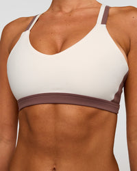 Woman wearing Force Sports Bra - Cocoa Powder-Off White | Model:Charli | Size:XS