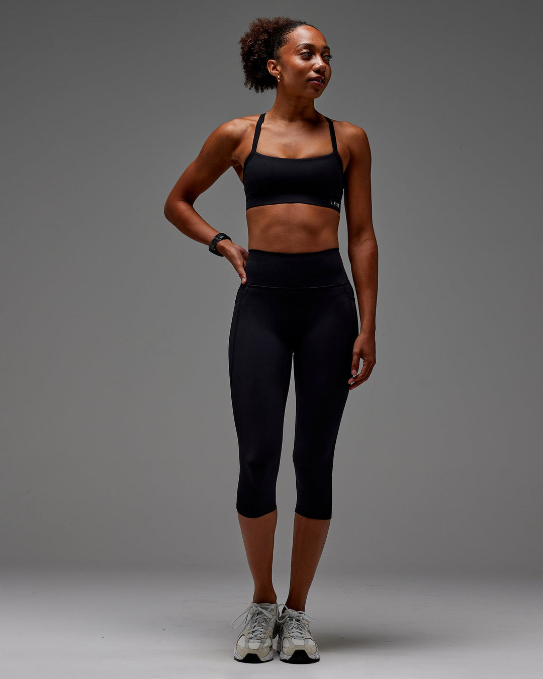 Woman wearing Fusion 3/4 Length Tight with Pockets in Black | Size:XS