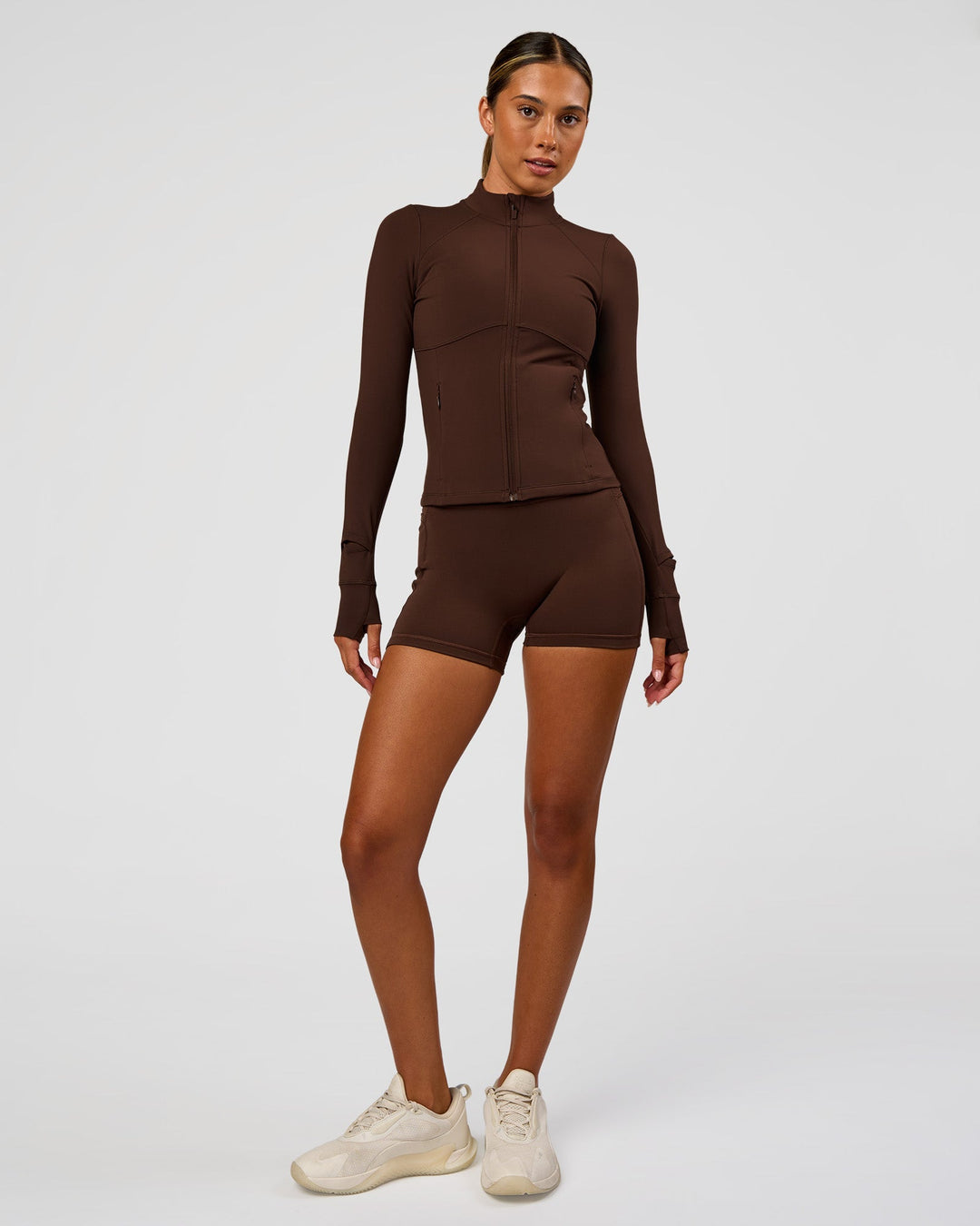 Woman wearing Fusion Active Jacket - Hot Chocolate | Model:Charli | Size:XS - view 9