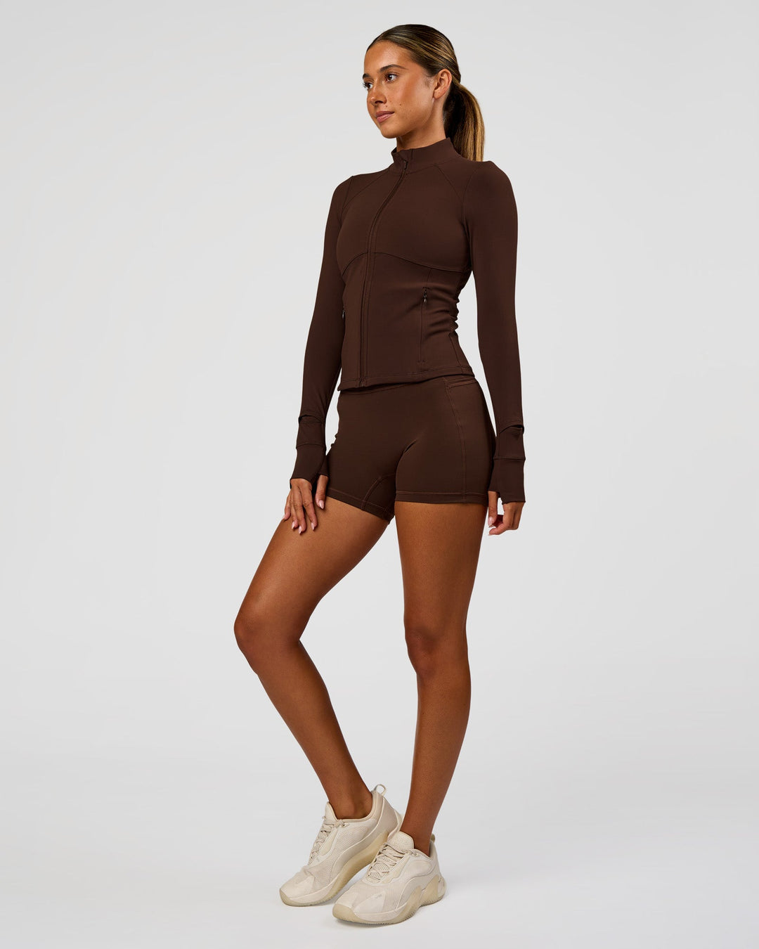 Woman wearing Fusion Active Jacket - Hot Chocolate | Model:Charli | Size:XS - view 7
