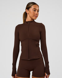 Woman wearing Fusion Active Jacket - Hot Chocolate | Model:Charli | Size:XS | Thumbnail Index: 7