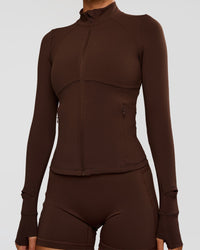 Woman wearing Fusion Active Jacket - Hot Chocolate | Model:Charli | Size:XS | Thumbnail Index: 9