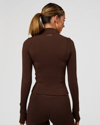 Woman wearing Fusion Active Jacket - Hot Chocolate | Model:Charli | Size:XS | Thumbnail Index: 4