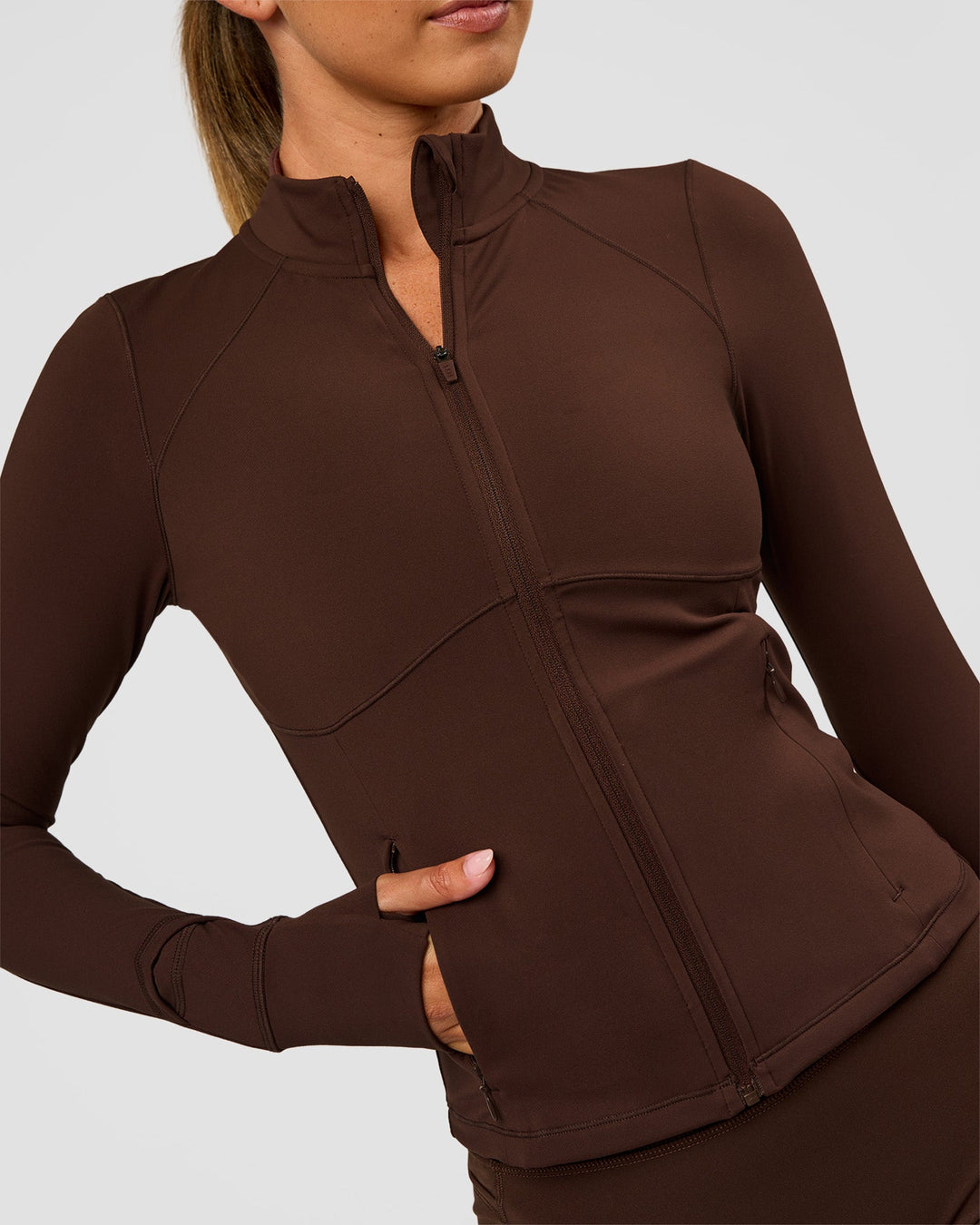 Woman wearing Fusion Active Jacket - Hot Chocolate | Model:Charli | Size:XS - view 6