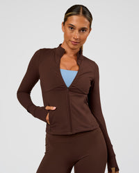 Woman wearing Fusion Active Jacket - Hot Chocolate | Model:Charli | Size:XS | Thumbnail Index: 1