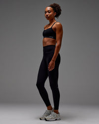 Woman wearing Fusion Ultra High-Rise Full Length Legging Pockets - Black | Model: Txai | Size:XS
