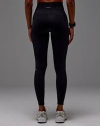 Woman wearing Fusion Ultra High-Rise Full Length Legging Pockets - Black | Model: Txai | Size:XS