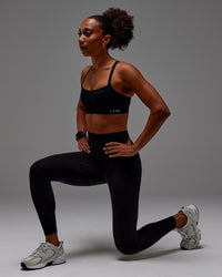 Woman wearing Fusion Ultra High-Rise Full Length Legging Pockets - Black | Model: Txai | Size:XS