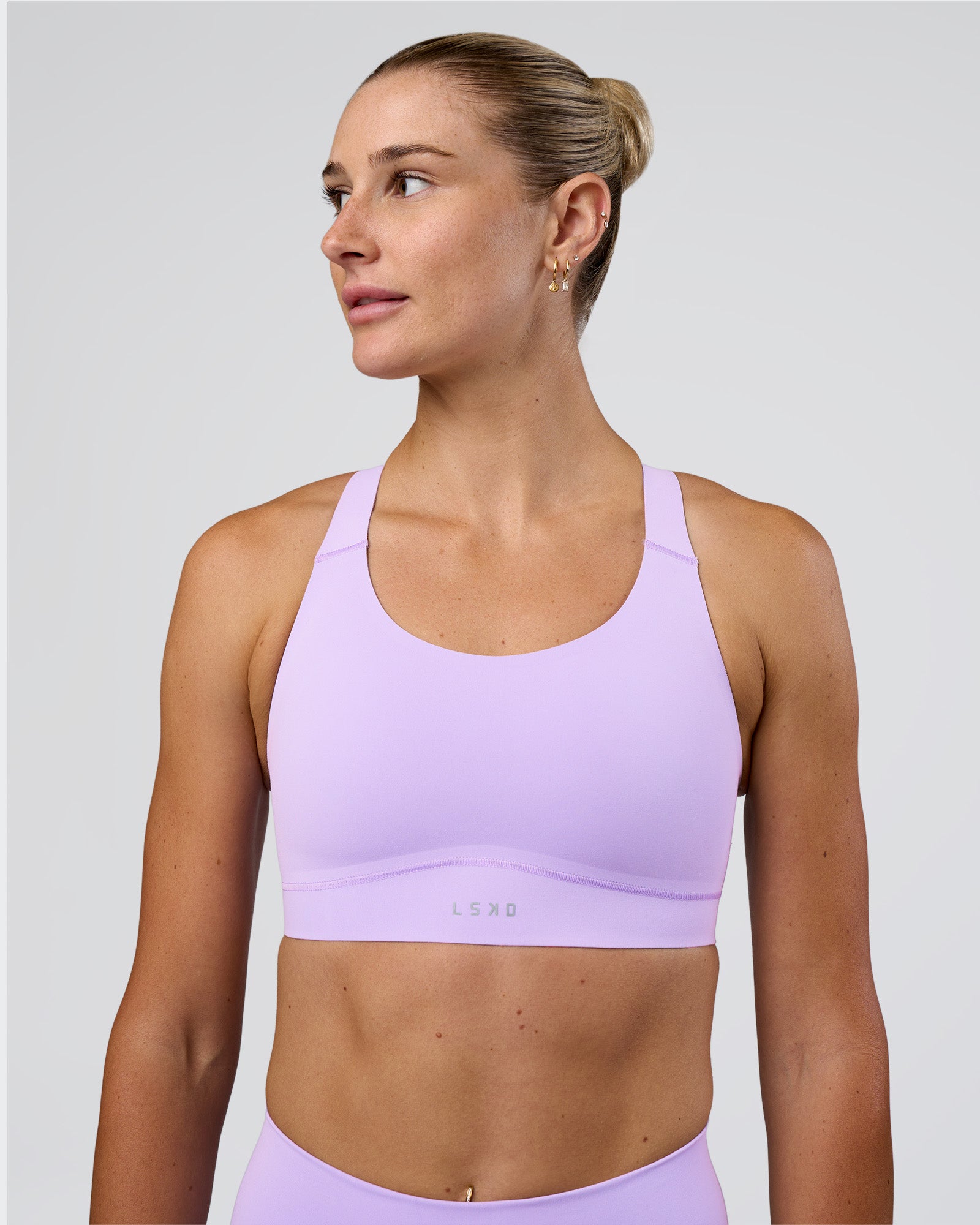 Woman wearing Fusion Sports Bra 2.0 - Pale Lilac | Model:Emelia | Size:XS