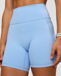 Woman wearing Fusion Ultra High-Rise 6" Short Pockets - Open Air | Model:Maja | Size:XS