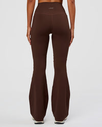 Woman wearing Fusion Ultra High-Rise Flared Legging Pockets - Hot Chocolate | Model:Charli | Size:XS | Thumbnail Index: 3